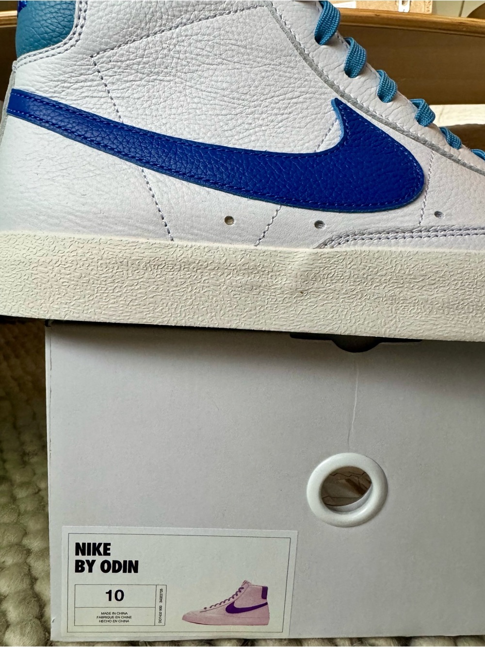 Nike White Leather High-Top Sneakers with Blue Swoosh